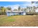 A single-story home with a well-maintained lawn and a driveway leading to an attached garage at 2935 Apaloosa Trl, Deltona, FL 32738