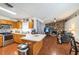 Open kitchen flowing into a living area with a stone fireplace at 2935 Apaloosa Trl, Deltona, FL 32738