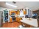 Bright kitchen featuring oak cabinets and stainless steel appliances at 2935 Apaloosa Trl, Deltona, FL 32738
