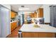 Well-lit kitchen with stainless steel appliances and white countertops at 2935 Apaloosa Trl, Deltona, FL 32738