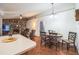 Open-concept living room with fireplace and dining area view at 2935 Apaloosa Trl, Deltona, FL 32738