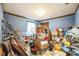 Cluttered room filled with boxes and storage containers, appearing disorganized at 2935 Apaloosa Trl, Deltona, FL 32738