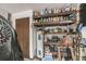 Cluttered utility room with a water heater and shelving filled with supplies at 2935 Apaloosa Trl, Deltona, FL 32738