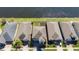 An aerial view of a single Gathering home including the red property line and a beautiful water view at 3018 Jardin St, Kissimmee, FL 34741