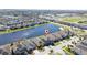 Aerial view of the home showing proximity to the lake and nearby community amenities at 3018 Jardin St, Kissimmee, FL 34741