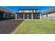 Beautiful backyard features a view of the water, a fenced perimeter, and a screened lanai at 3018 Jardin St, Kissimmee, FL 34741