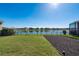 Enjoy picturesque water views from this spacious backyard, complemented by lush greenery at 3018 Jardin St, Kissimmee, FL 34741