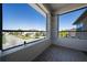 Enjoy relaxing outdoor views from this tiled balcony with a screen and brick supports at 3018 Jardin St, Kissimmee, FL 34741