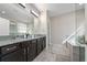 Spacious bathroom features a double vanity with granite countertops and a separate tub at 3018 Jardin St, Kissimmee, FL 34741