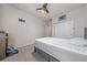 Bedroom with a ceiling fan, wall mounted television, and a double-door closet at 3018 Jardin St, Kissimmee, FL 34741
