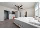 Large bedroom featuring ceiling fan, closet and easy access to bathroom and laundry at 3018 Jardin St, Kissimmee, FL 34741