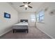 Bright bedroom with large windows, a ceiling fan, and neutral carpet at 3018 Jardin St, Kissimmee, FL 34741