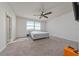 Spacious bedroom with large windows for ample natural light and a stylish ceiling fan at 3018 Jardin St, Kissimmee, FL 34741