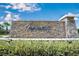 Tapestry community entrance with stone waterfall feature and lush landscaping, offering an upscale, welcoming environment at 3018 Jardin St, Kissimmee, FL 34741
