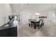 Modern dining room featuring stylish table and chairs, elegant light fixture, and contemporary decor at 3018 Jardin St, Kissimmee, FL 34741