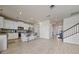 Bright, open kitchen with white cabinets, stainless steel appliances, and a center island with bar seating at 3018 Jardin St, Kissimmee, FL 34741