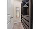 Well-organized walk-in closet features built-in shelves, drawers, hanging rods, and a full-length mirror at 3018 Jardin St, Kissimmee, FL 34741