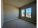 Bright bedroom featuring neutral walls, carpet floors and two sunny windows offering natural light at 3108 Firethorn Cir, Daytona Beach, FL 32124