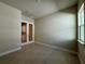 Flex room with tile flooring, window, and glass french doors leading to another room at 3108 Firethorn Cir, Daytona Beach, FL 32124