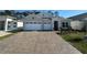 Charming single-story home with a two-car garage and a beautifully paved driveway at 3108 Firethorn Cir, Daytona Beach, FL 32124