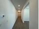 Bright hallway with recessed lighting and wood-look flooring at 3108 Firethorn Cir, Daytona Beach, FL 32124