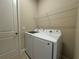 A laundry room featuring a new Samsung washer and dryer set and wire shelving at 3108 Firethorn Cir, Daytona Beach, FL 32124