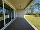 Covered patio with stylish brick pavers and sliding glass doors, perfect for outdoor relaxation at 3108 Firethorn Cir, Daytona Beach, FL 32124