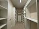 Spacious walk-in closet with custom shelving and drawers, providing ample storage and organization at 3108 Firethorn Cir, Daytona Beach, FL 32124