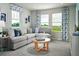 Spacious living room featuring a comfortable sectional sofa and lots of natural light at 313 Castle Dr, Lake Alfred, FL 33850