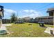 The backyard has a pool, grill, grass, and a wood fence at 3141 Wainwright St, Deltona, FL 32738