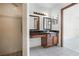 Bathroom featuring a walk-in shower, wood vanity, and tile flooring at 3141 Wainwright St, Deltona, FL 32738