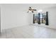 Bedroom featuring tile floors, windows, and vaulted ceiling at 3141 Wainwright St, Deltona, FL 32738