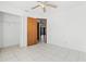Bright bedroom with tile floors and closet, complemented by ample natural light streaming through the doorway at 3141 Wainwright St, Deltona, FL 32738