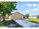 Attractive home with an attached garage and a well-kept lawn, perfect for suburban living and outdoor activities at 3141 Wainwright St, Deltona, FL 32738