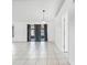 Bright living room with neutral tile flooring, offering ample space for furniture arrangement and design customization at 3141 Wainwright St, Deltona, FL 32738