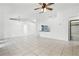 Expansive living space with tile flooring, ideal for entertaining and relaxation, with easy access to other areas of the home at 3141 Wainwright St, Deltona, FL 32738