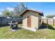 Exterior view of the yard's shed and grill against a clear blue sky at 3141 Wainwright St, Deltona, FL 32738