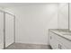 Elegant bathroom featuring a glass-enclosed shower and a stylish granite vanity at 317 Castle Dr, Lake Alfred, FL 33850