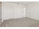 Cozy bedroom with neutral carpet, white walls, and convenient access to other rooms at 317 Castle Dr, Lake Alfred, FL 33850