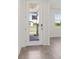 Bright foyer with a glass front door, tile flooring, and a view of the outdoors at 317 Castle Dr, Lake Alfred, FL 33850