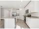 Modern kitchen featuring stainless steel appliances, granite countertops, and a functional layout at 317 Castle Dr, Lake Alfred, FL 33850