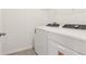 Functional laundry room features a modern washer and dryer set for convenient chores at 317 Castle Dr, Lake Alfred, FL 33850