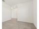 Open-concept living room with tile floors, white walls, and seamless flow to other spaces at 317 Castle Dr, Lake Alfred, FL 33850