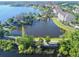 Panoramic view of a serene lake, walking path, and fountain creating a peaceful atmosphere at 3291 Westchester Square Blvd # 203, Orlando, FL 32835