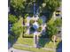 Overhead view of manicured green space with gazebo, trees, parking, and landscaped beds at 3291 Westchester Square Blvd # 203, Orlando, FL 32835