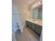 Bathroom featuring a single sink vanity with an oversized countertop and modern cabinets at 3291 Westchester Square Blvd # 203, Orlando, FL 32835