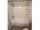 Bathroom features a clean white bathtub with a shower head and tile surround at 3291 Westchester Square Blvd # 203, Orlando, FL 32835