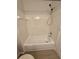 Bathroom features a clean white bathtub with a shower head and tile surround at 3291 Westchester Square Blvd # 203, Orlando, FL 32835