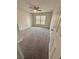 Bedroom features carpeted floors, a ceiling fan, and a window at 3291 Westchester Square Blvd # 203, Orlando, FL 32835