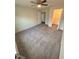 Bedroom with neutral carpet, a ceiling fan, and access to a walk-in closet at 3291 Westchester Square Blvd # 203, Orlando, FL 32835